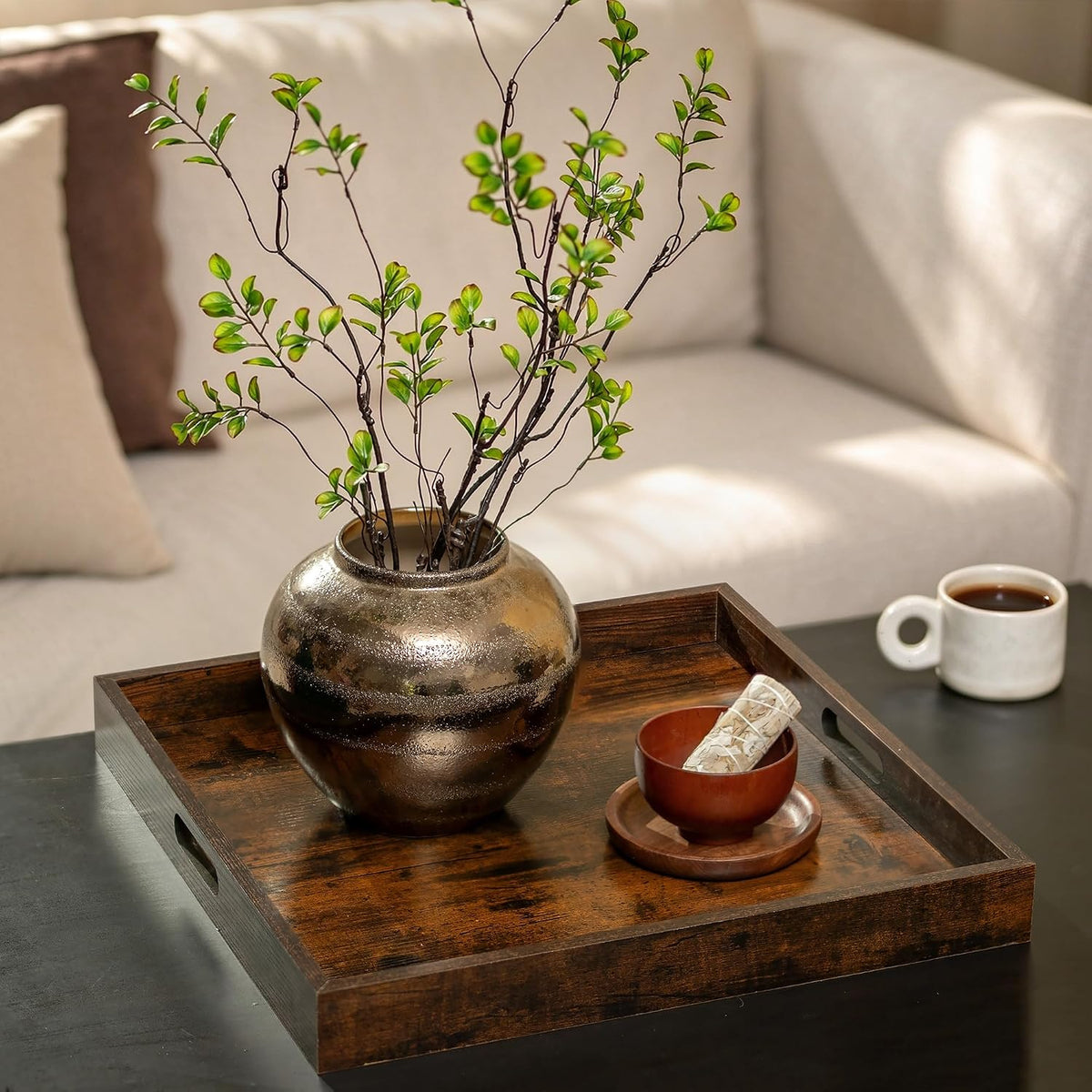 Ottoman tray styled on a living room ottoman