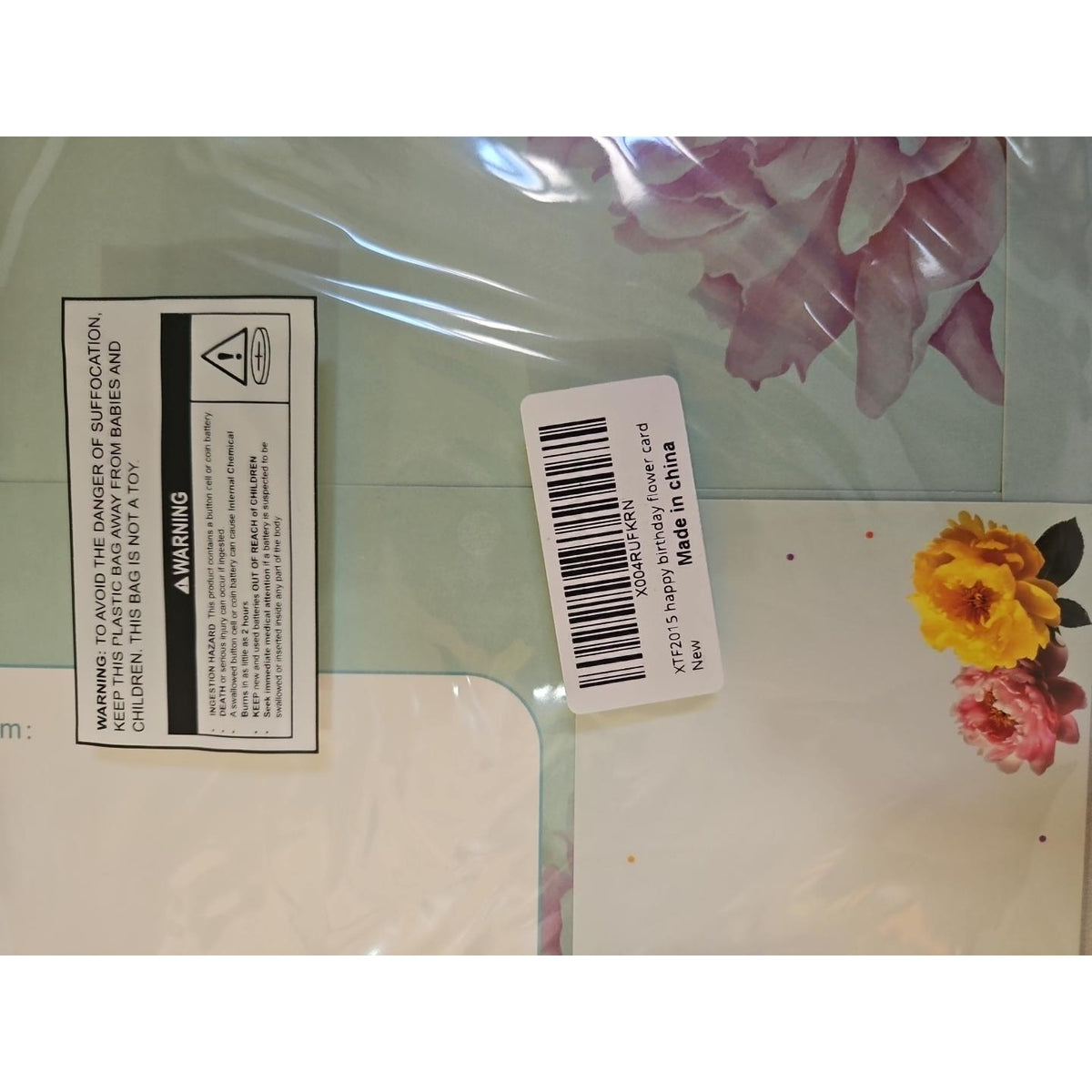 Back of the sealed card showing product label and battery safety warning