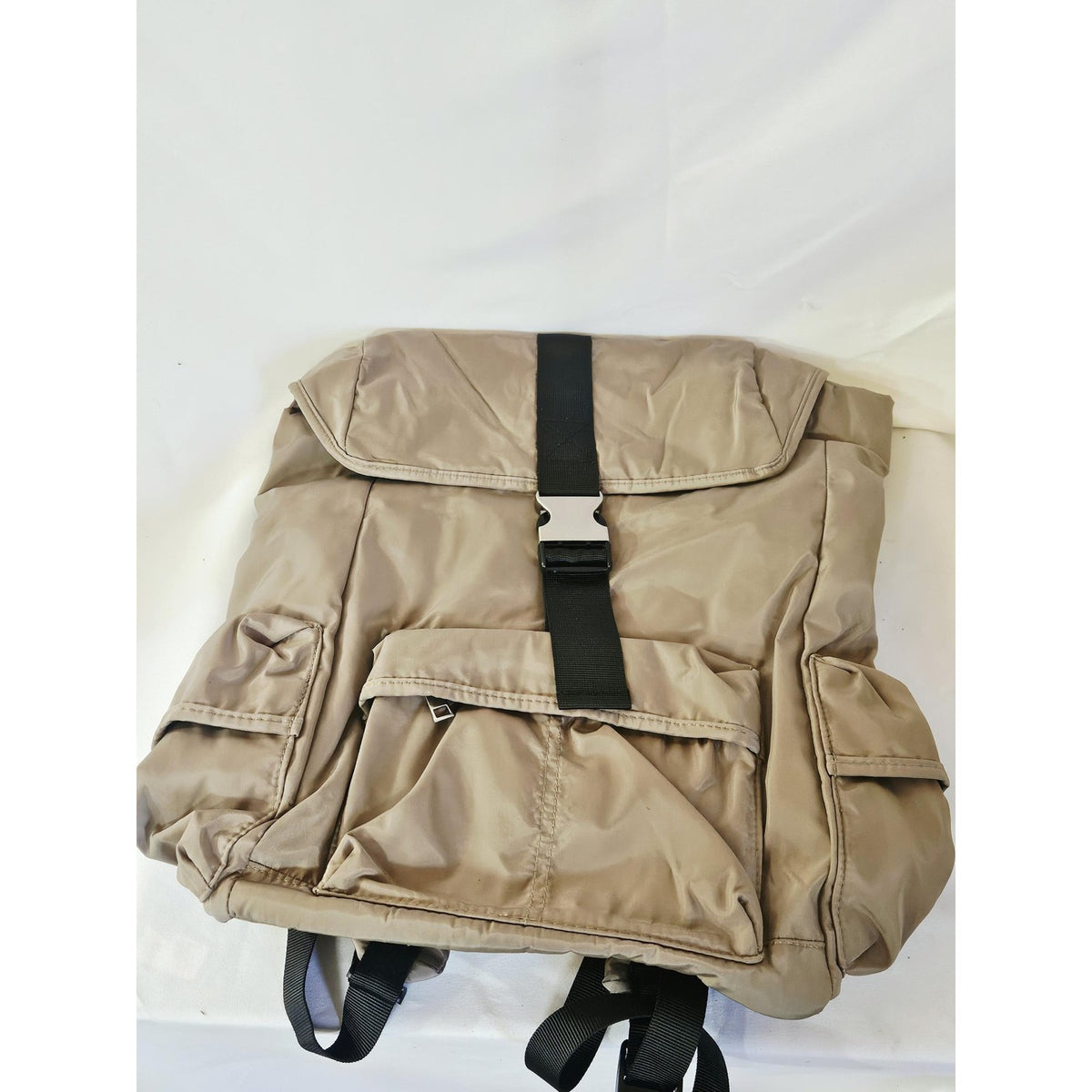 Brown flap backpack with buckle