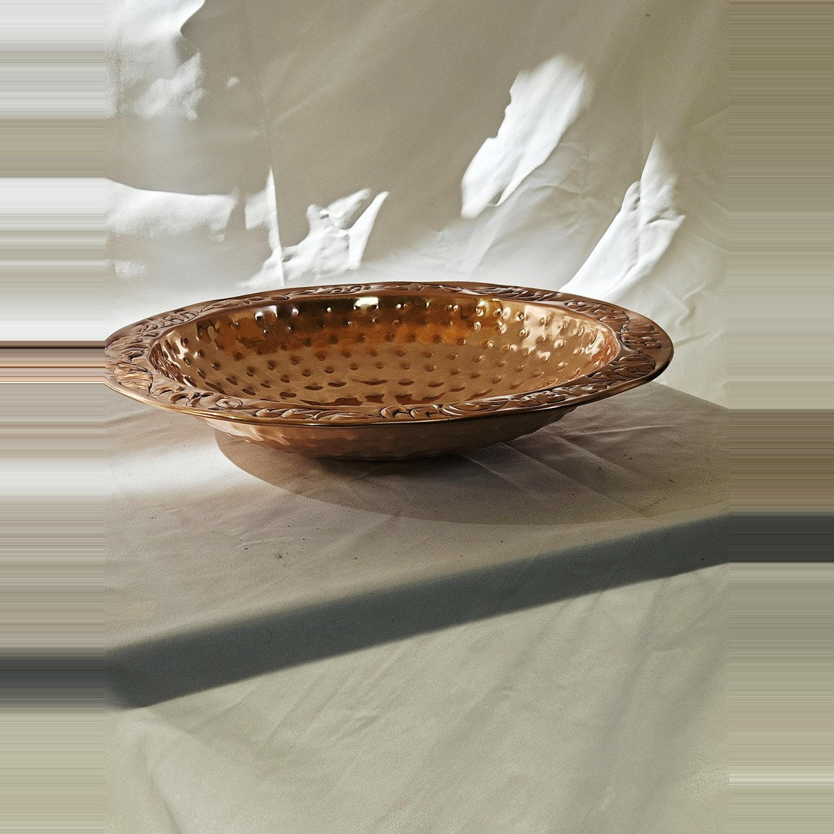 Copper bird bath basin side view