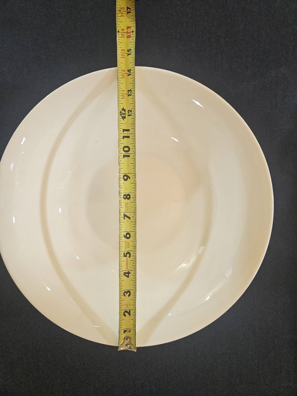 Mikasa Nellie serving bowl with tape measure showing approximately 14 inches