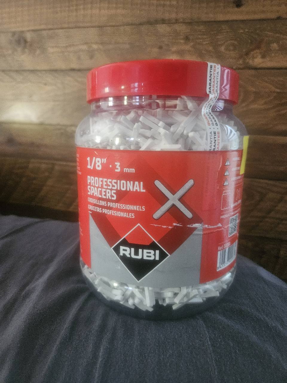 Actual RUBI 1/8 inch professional tile spacers jar, front