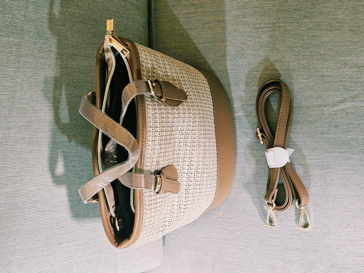 Tote open showing lined interior with removable crossbody strap