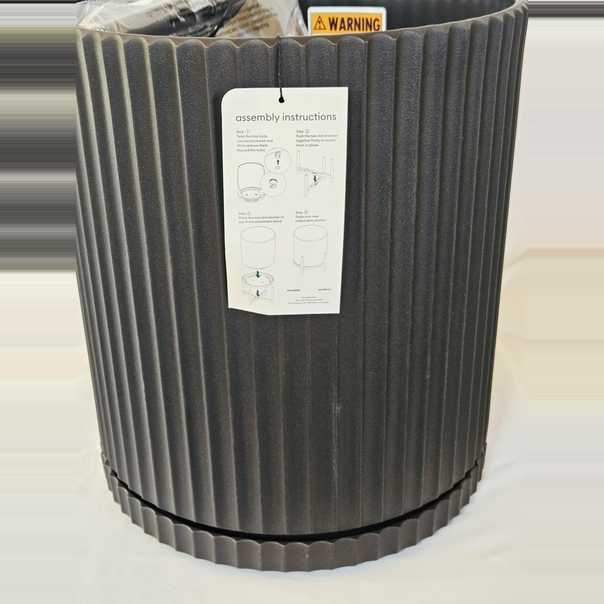Veradek planter with assembly instructions tag