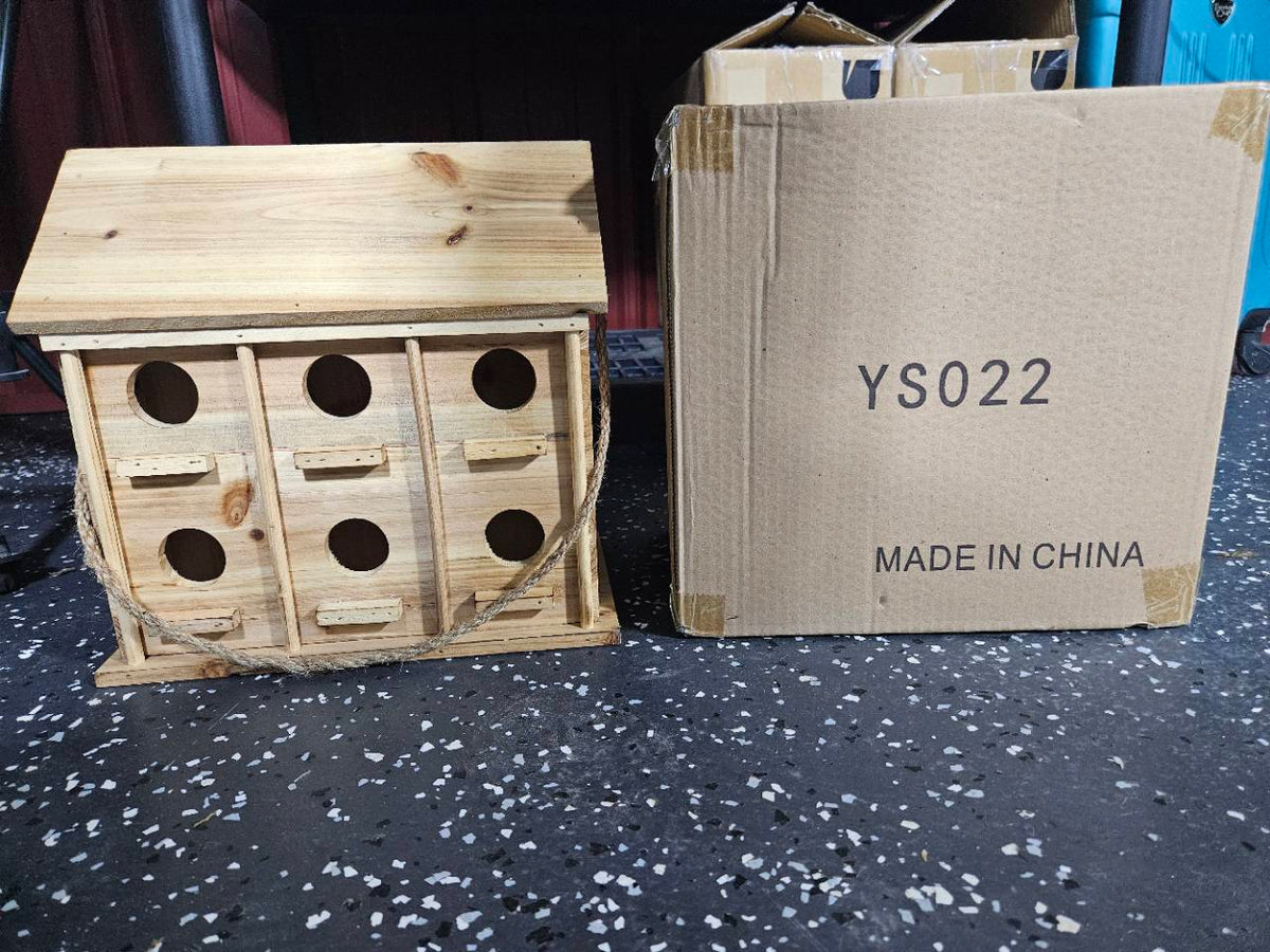Actual YS022 wooden hanging birdhouse with six visible front holes and its carton